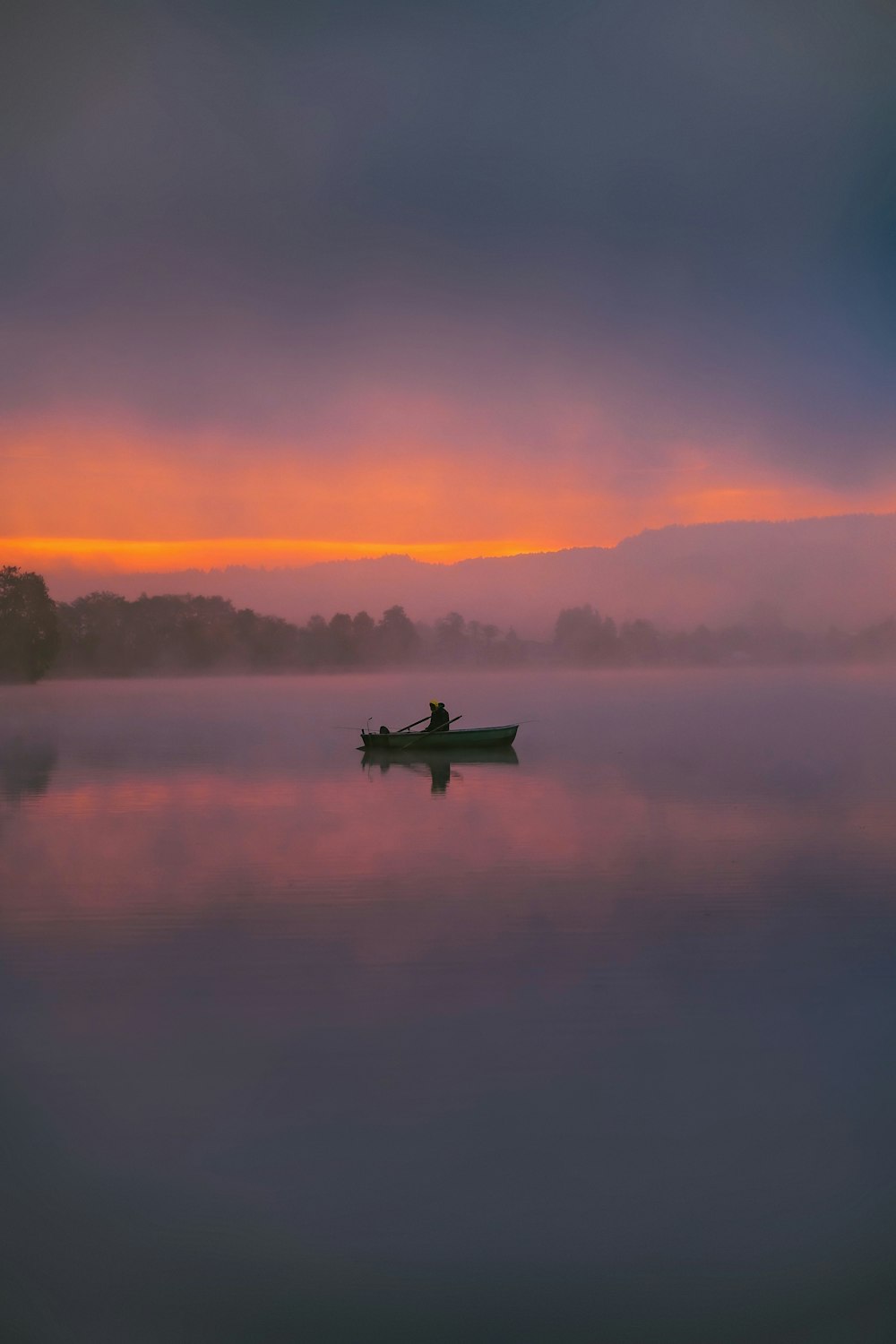 a person in a boat on a body of water