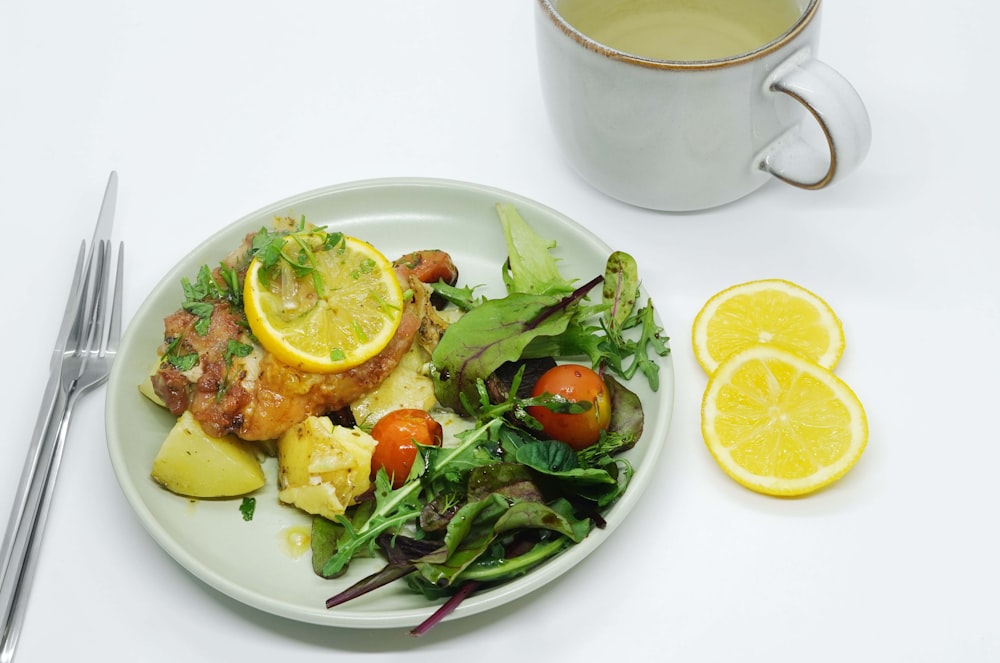 a plate of food and a cup of tea