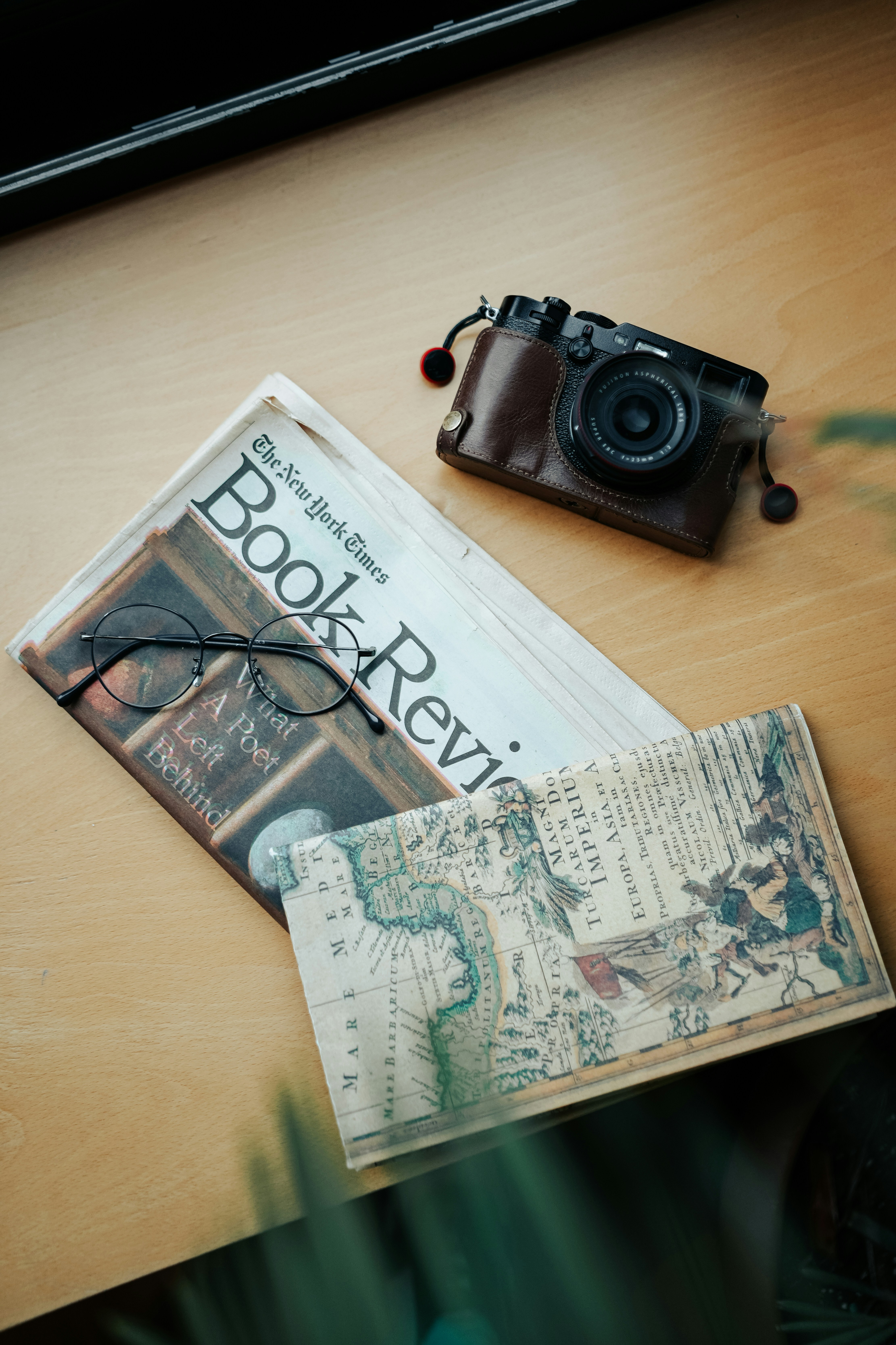 a camera and a book on a table