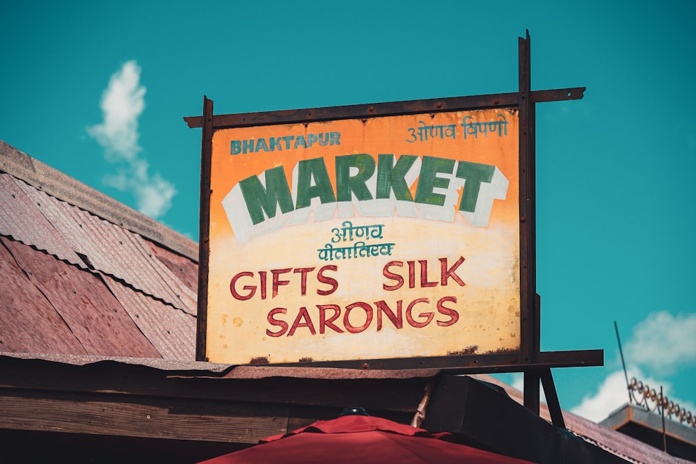 a sign for a market on the side of a building