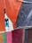 Close-up of colorful paper scraps and textured fabrics arranged for a collage project.