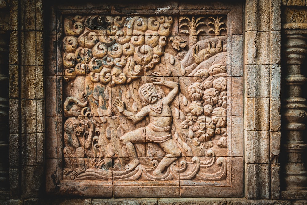 a carving on the side of a building