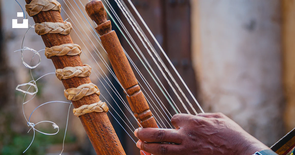 House Hand Instrument A close up of a person playing a musical instrument photo – Free Music ...