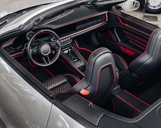 Modern automotive interior customized with black and red leather upholstery.