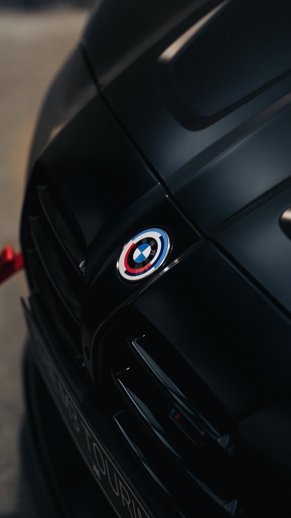 a close up of the emblem on a black sports car