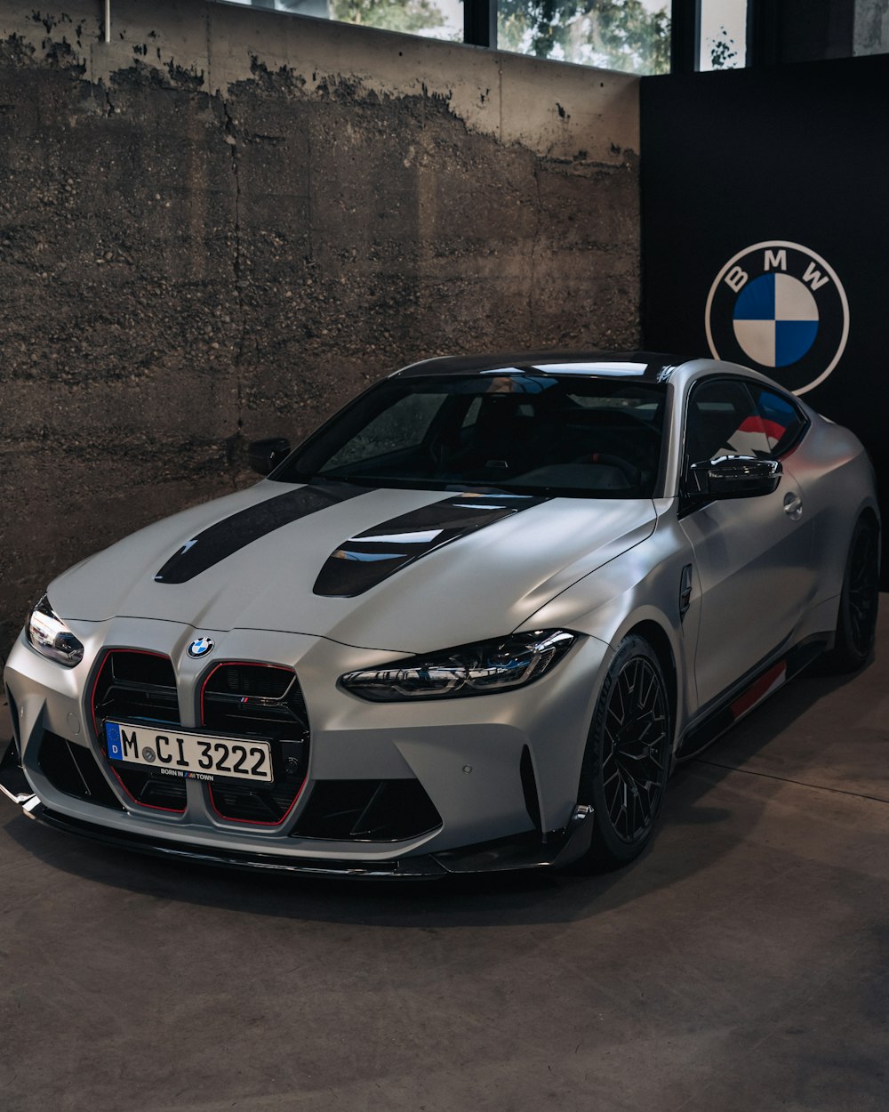 a silver sports car parked in a garage