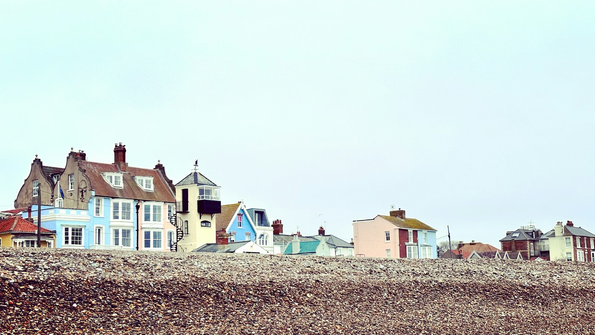 a row of houses sitting on top of a hill
