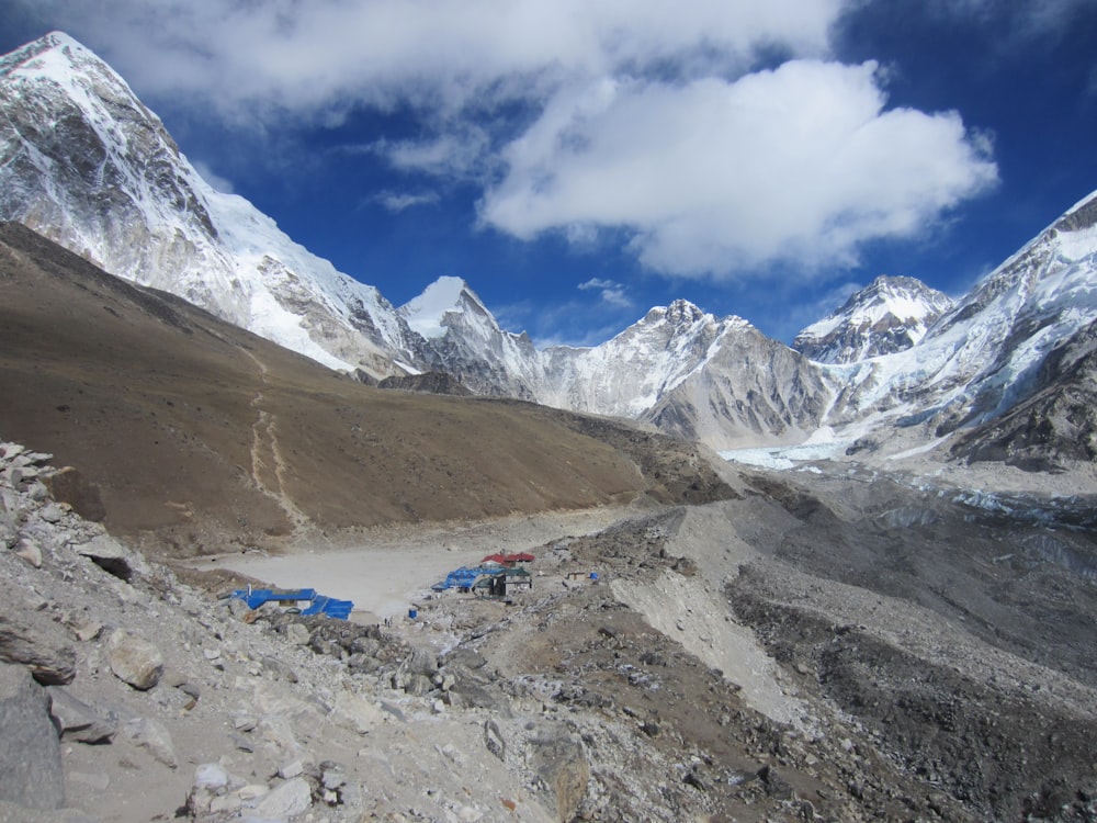 a group of tents set up in the mountains