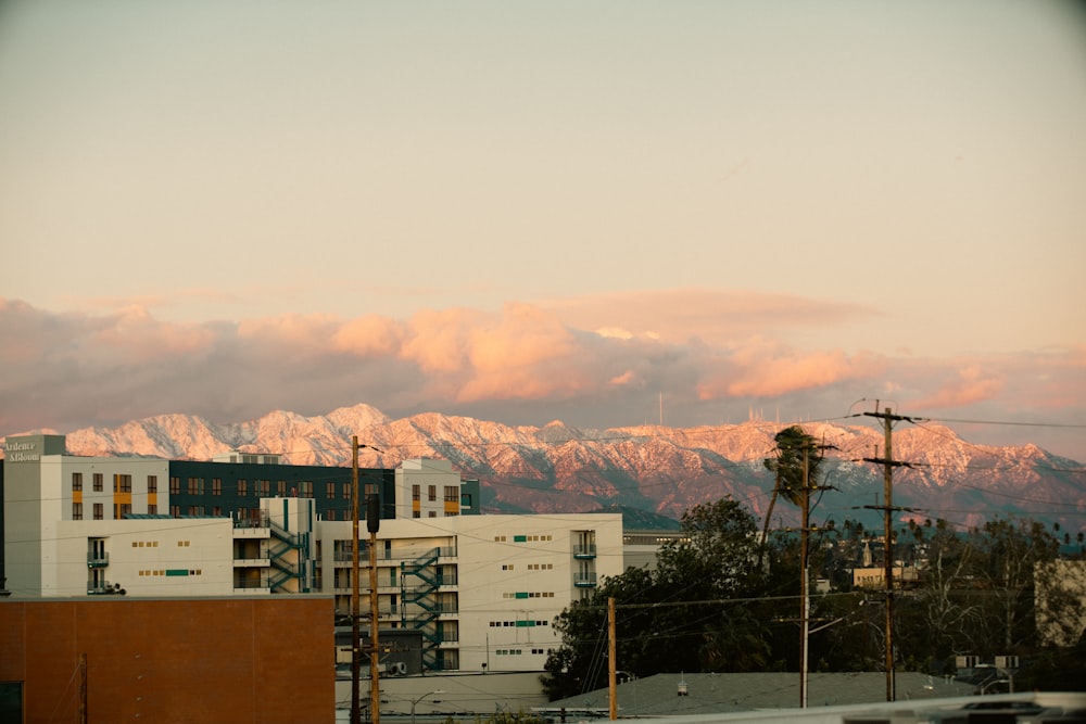 a view of a city with mountains in the background