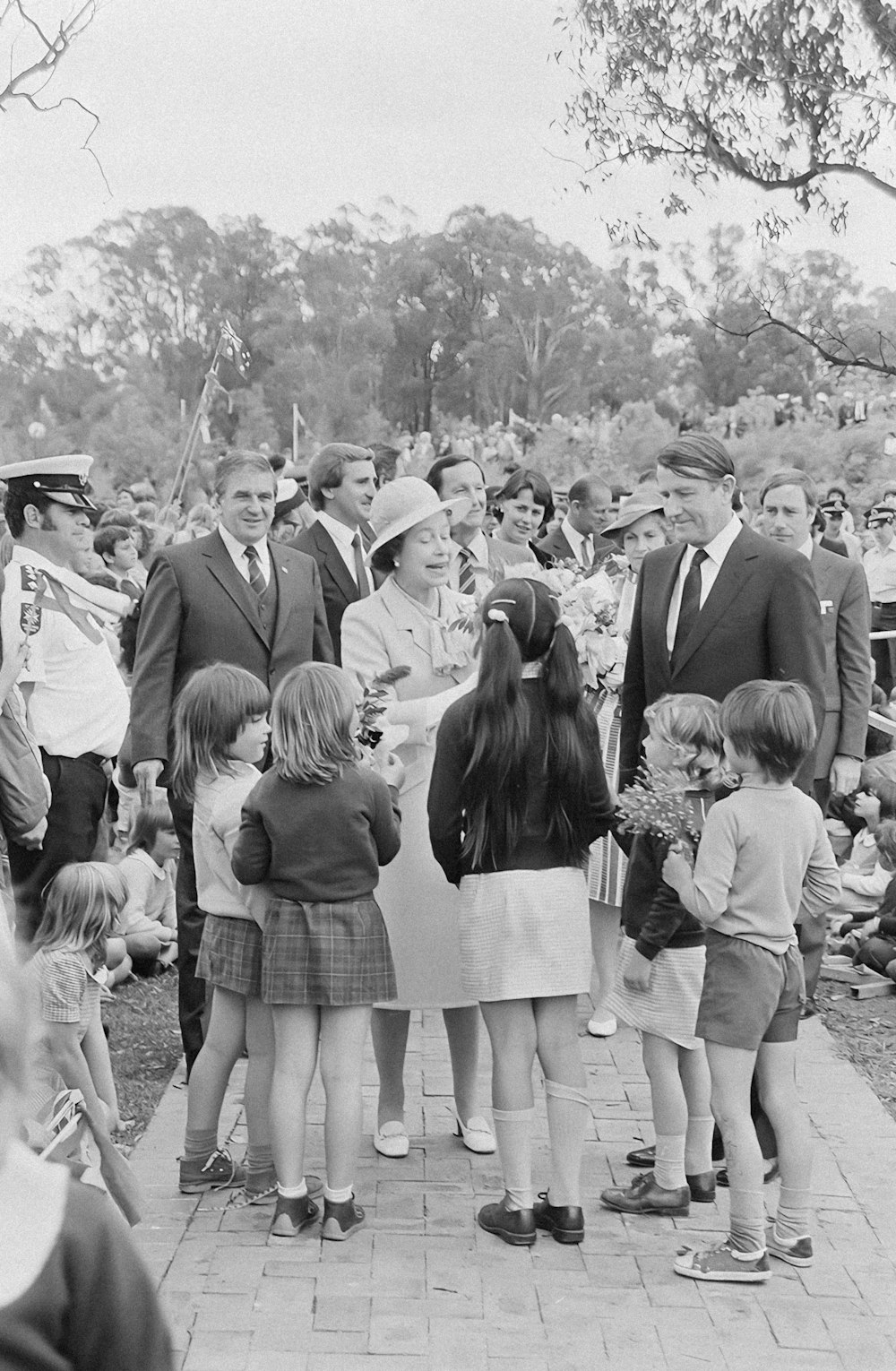 a group of people standing around each other