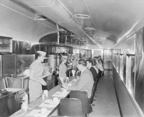 Friendly diner staff smiling behind the counter ready to serve