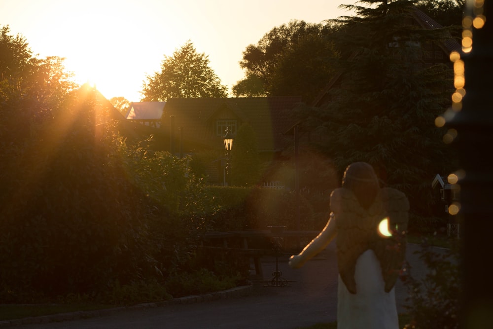 a bride and groom standing in front of the sun
