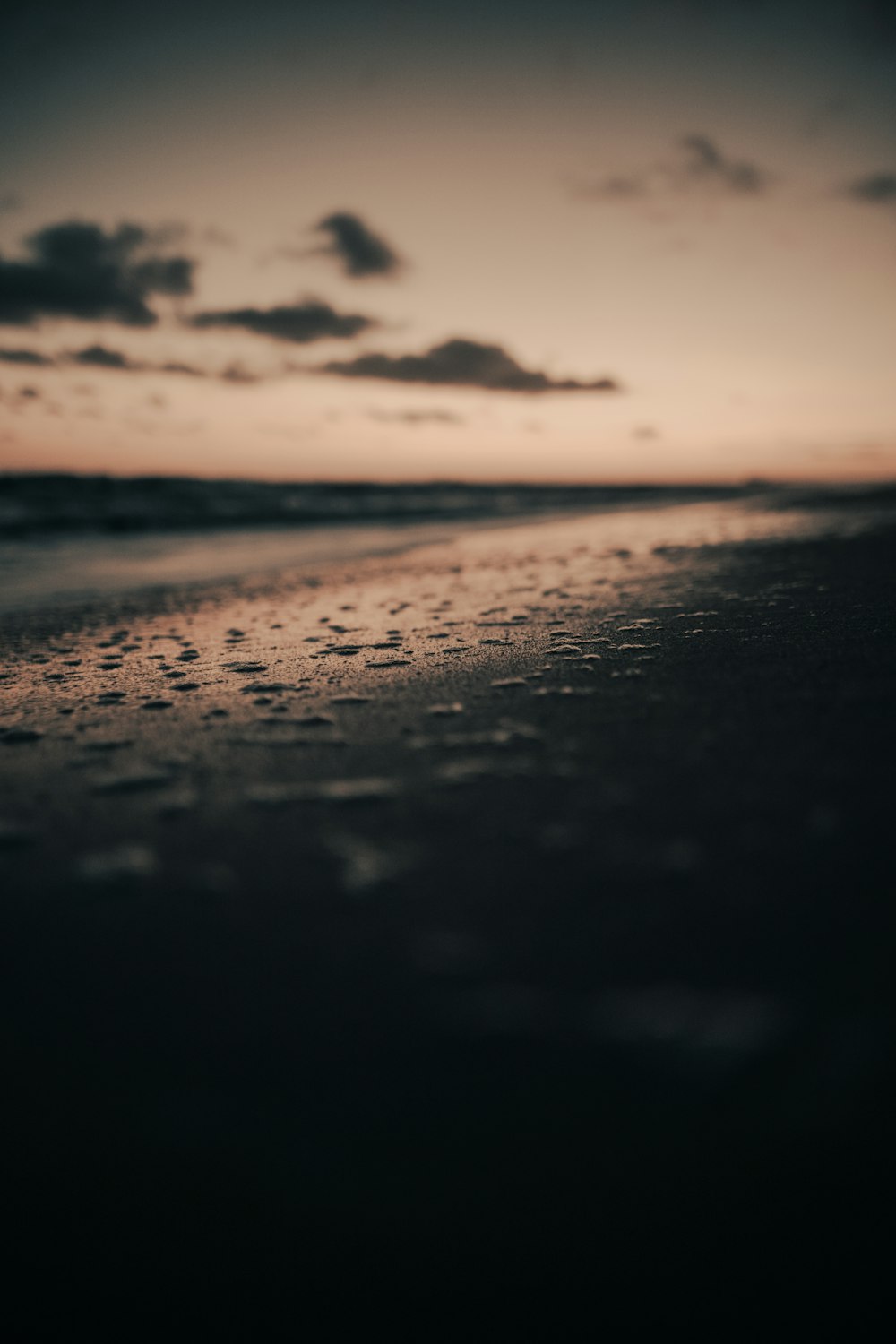 a blurry photo of a beach at sunset