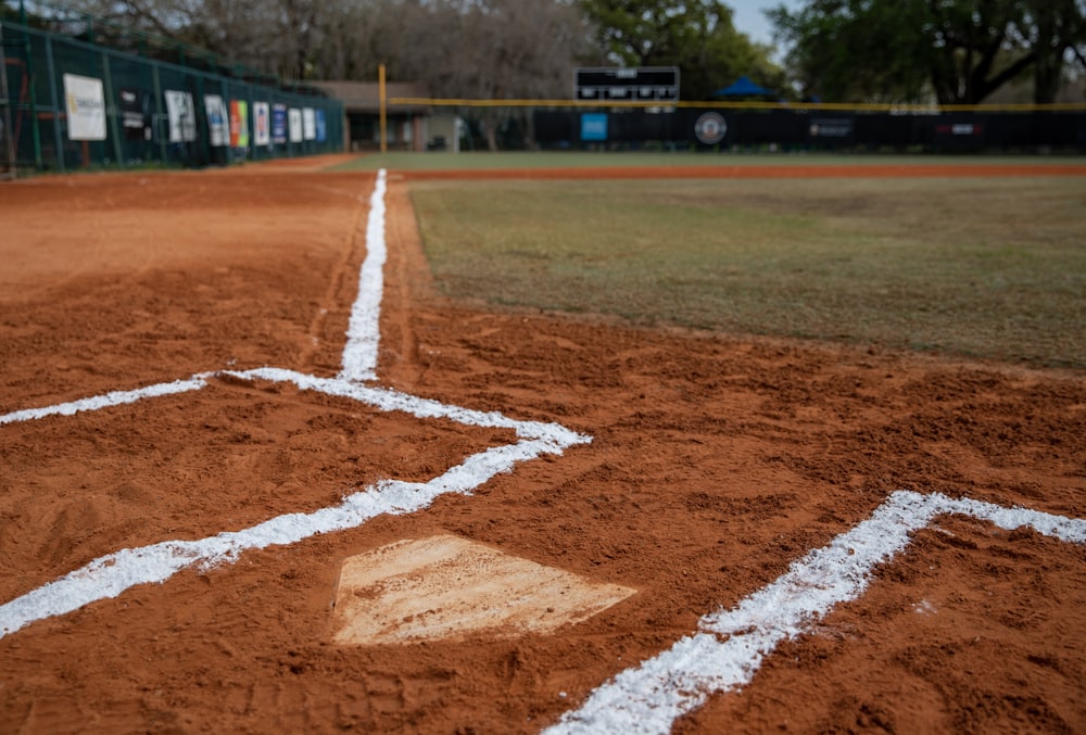 a baseball field with a diamond and a baseball field in the background