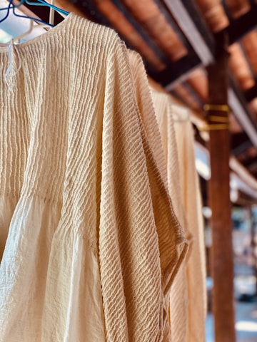 a white shirt hanging on a clothes line