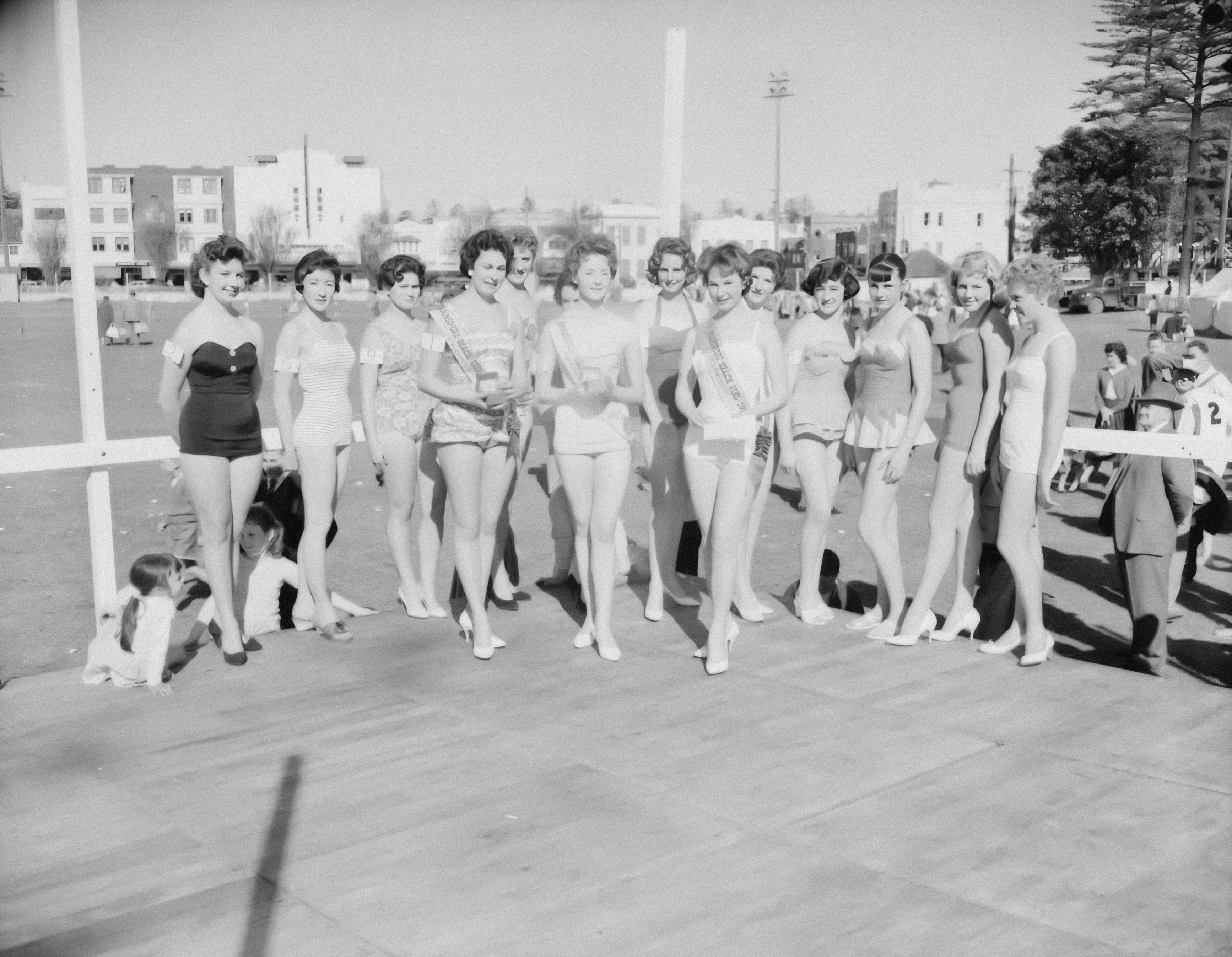 a group of women standing next to each other