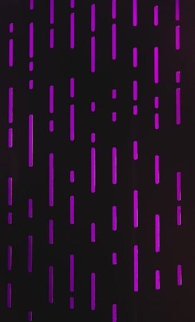 Vertical and horizontal purple neon lines are arranged on a dark background, resembling digital rain or futuristic code patterns.