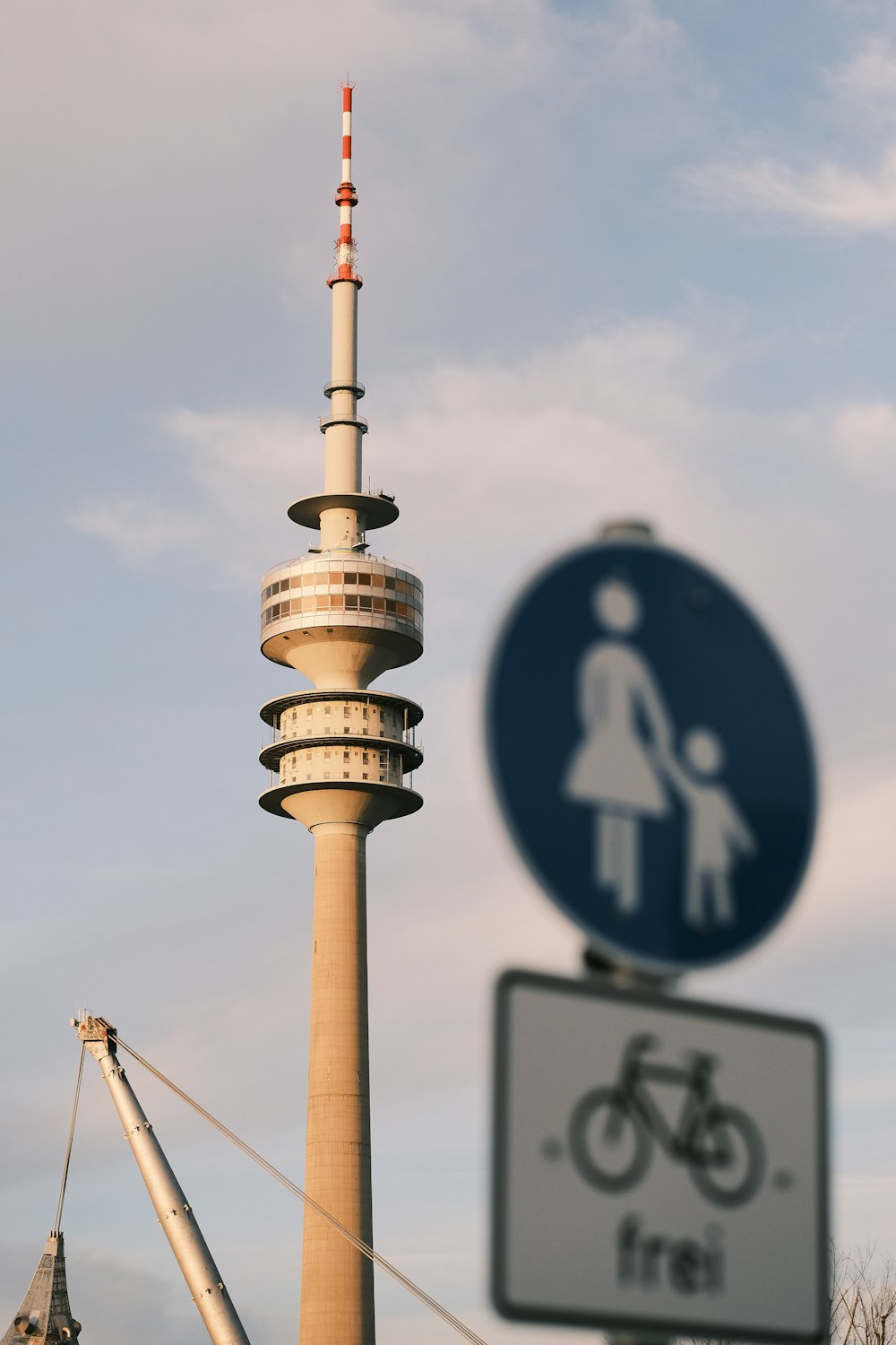 a tall tower with a sign next to it