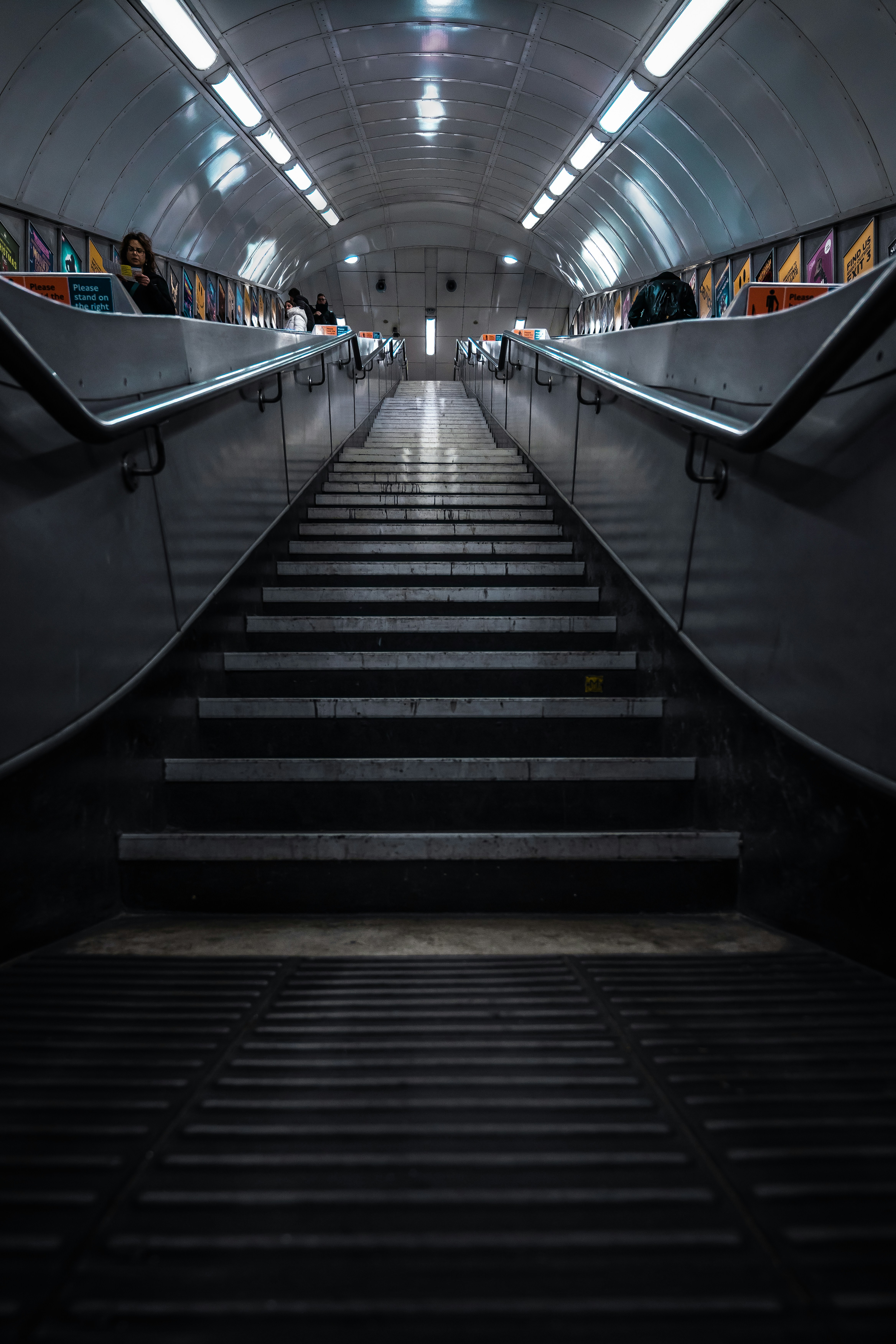 a set of stairs leading up to a subway station