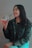 A smiling customer, Alice W., sharing her experience with Jea Strata.