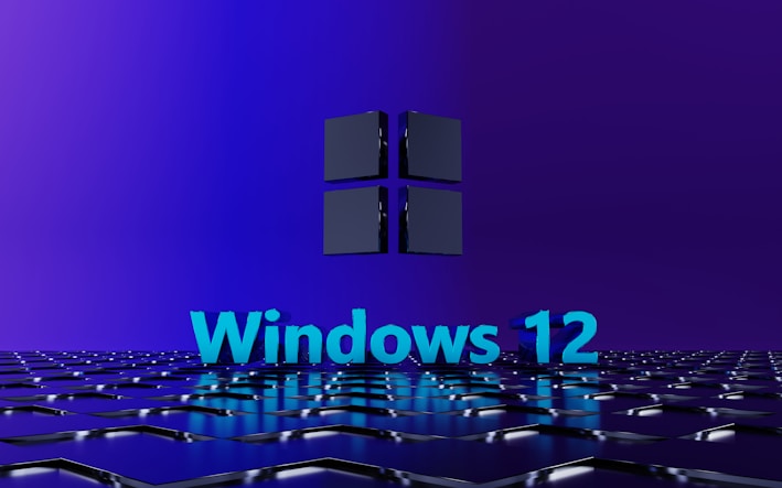 A 3D-rendered geometric surface in a digital environment features a prominently displayed text 'Windows 12' in bright blue, set against a stylish dark blue and purple background. Above the text, a three-dimensional cube icon reminiscent of a modern tech logo hovers, giving a futuristic and sleek appearance.