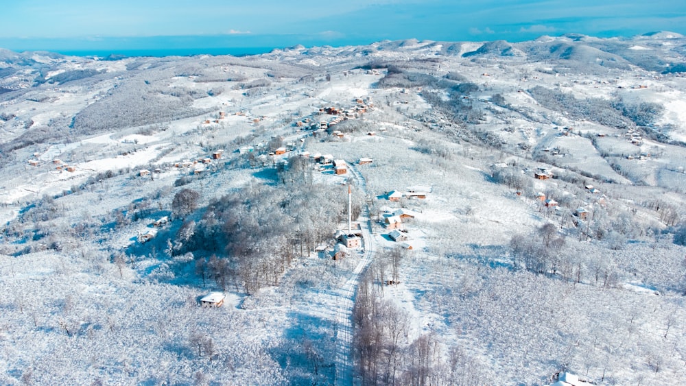 an aerial view of a snow covered mountain