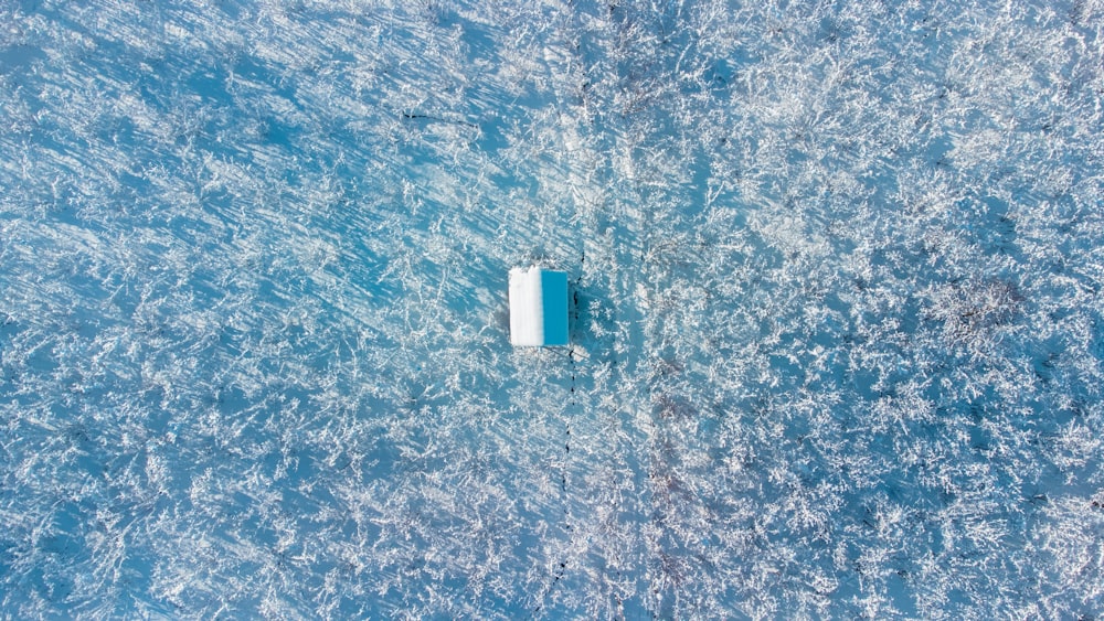 an aerial view of a boat in the water