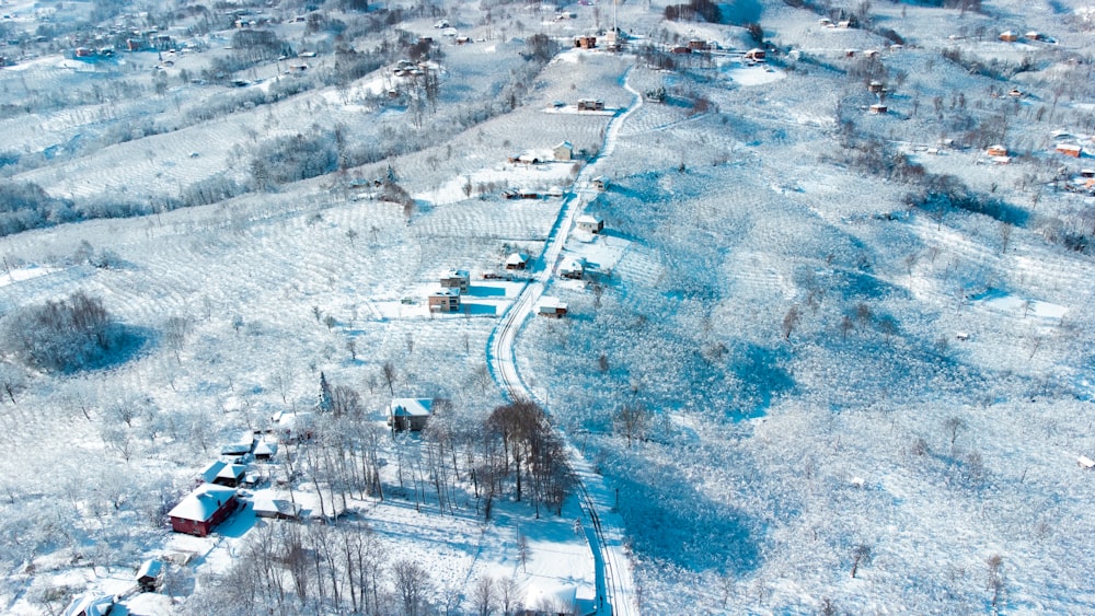 an aerial view of a snow covered village