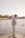 a man standing on a dock next to a body of water