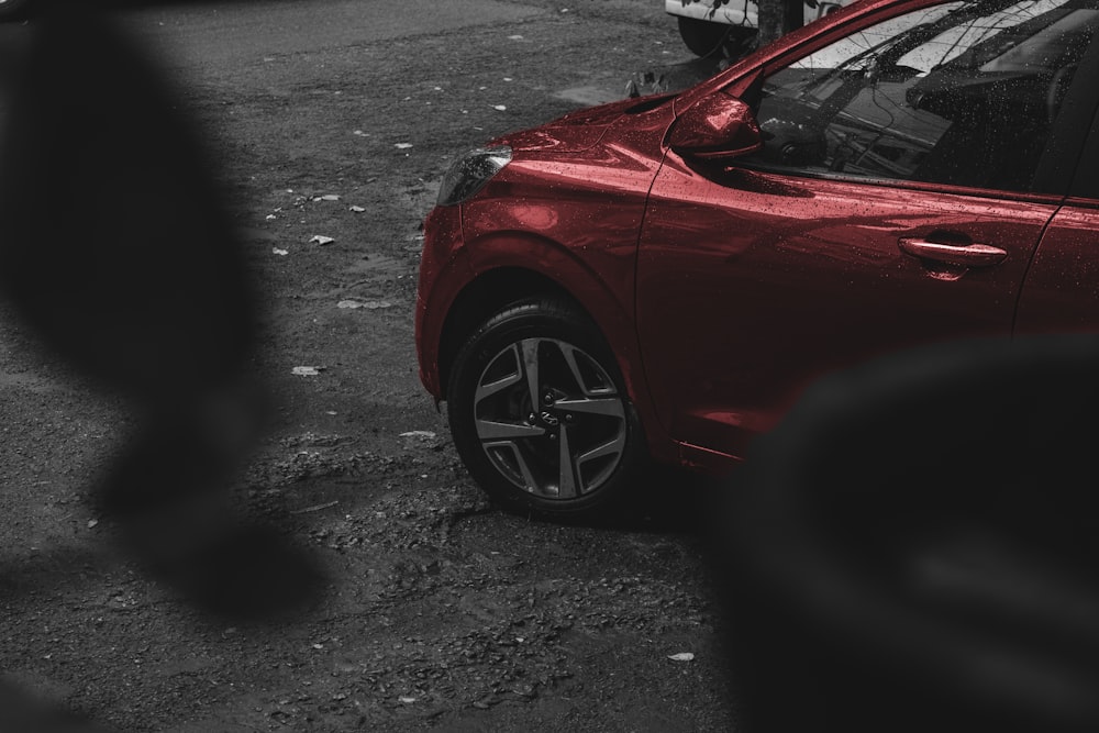 a red car parked on the side of the road