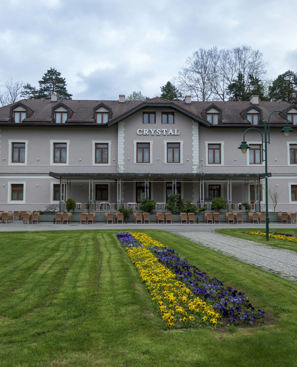 a large building with a lawn in front of it