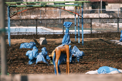 Tools and materials laid out for playground repair and maintenance.