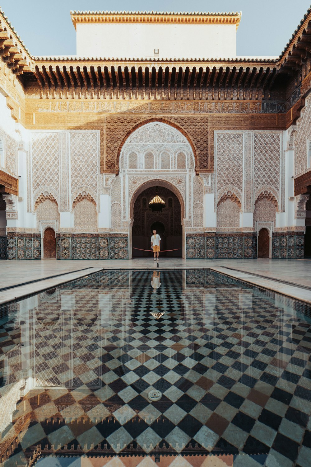 a person standing in a room with a tiled floor