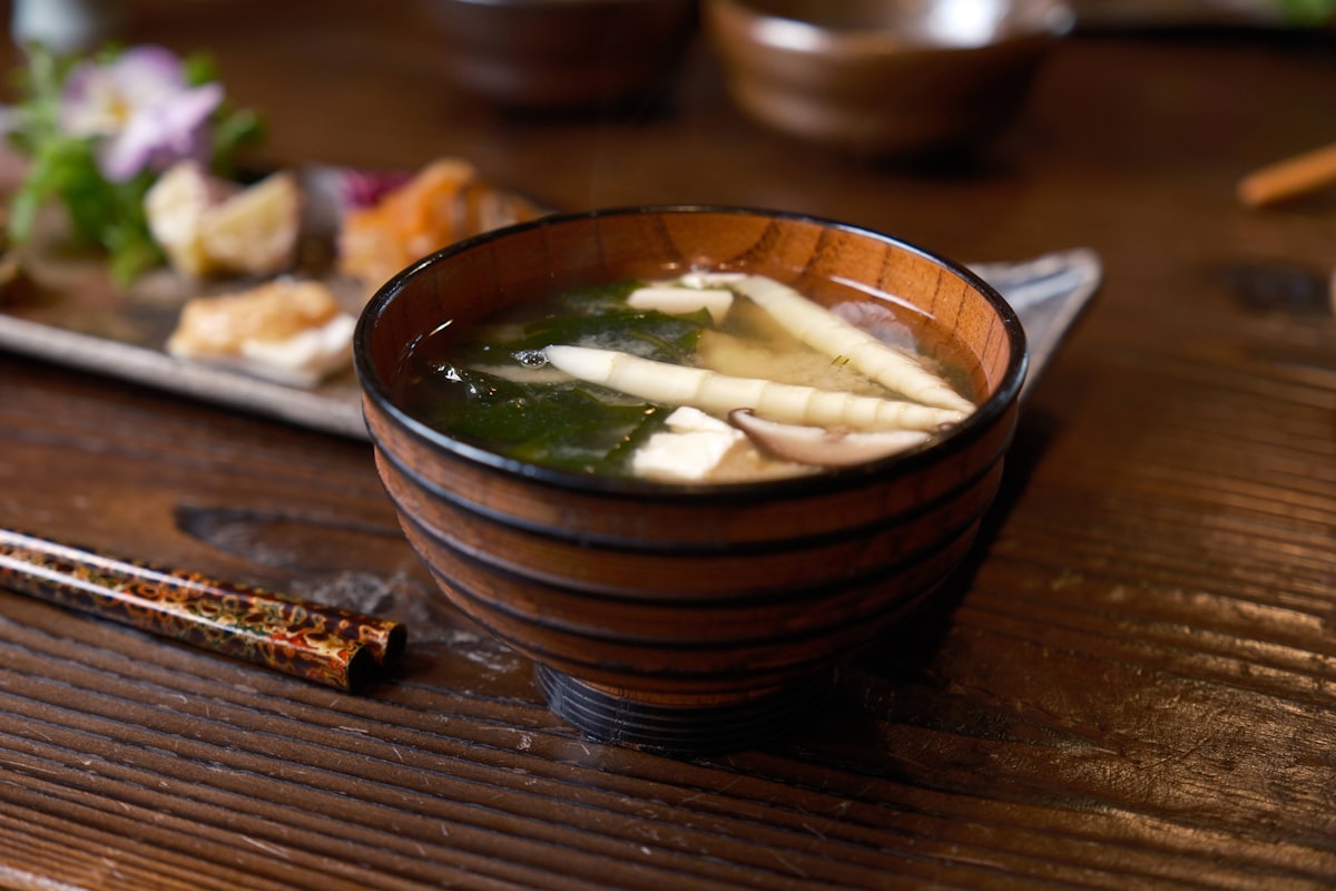 A bowl of Japanese miso soup with tofu and wakame seaweed