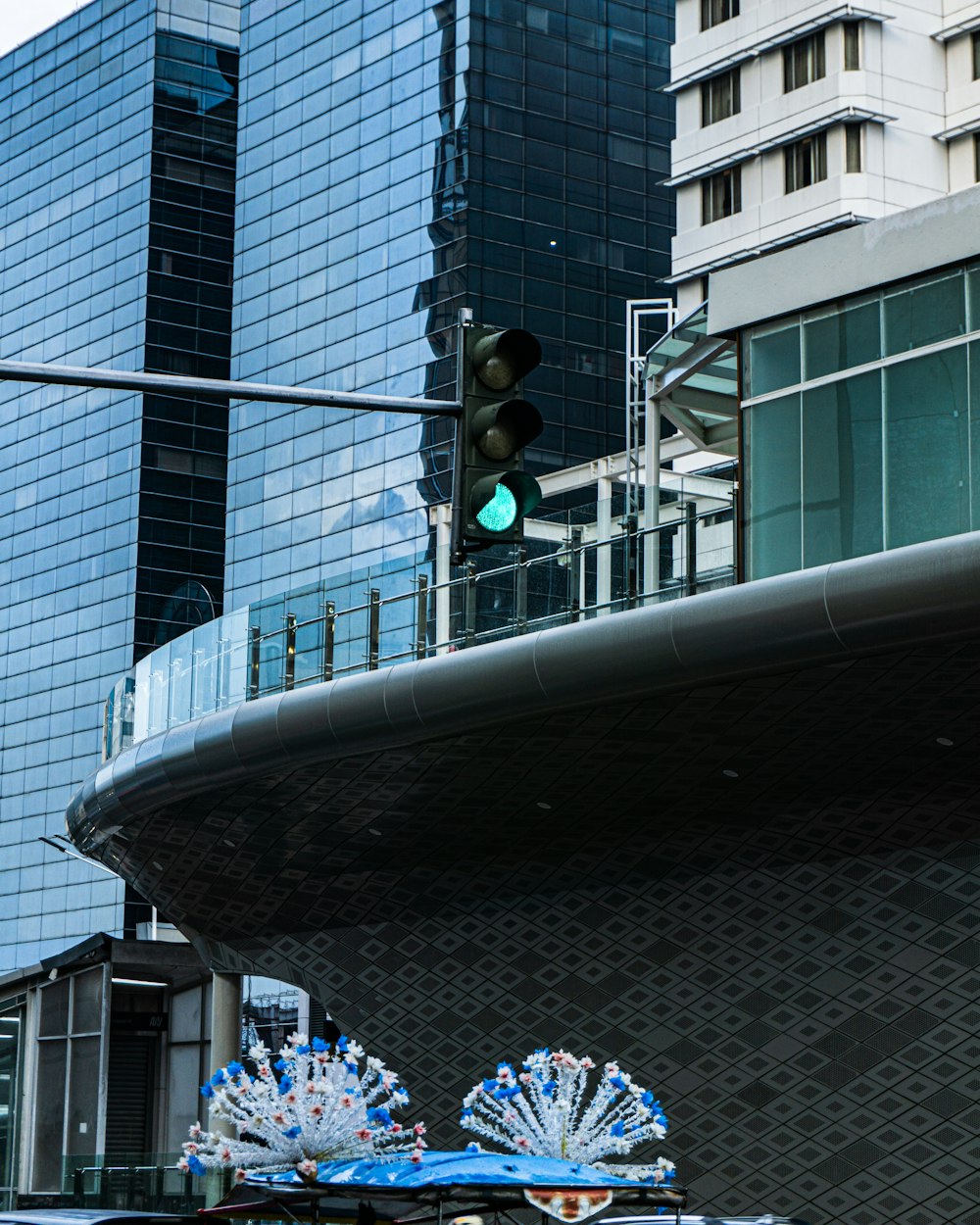 a car driving down a street next to tall buildings