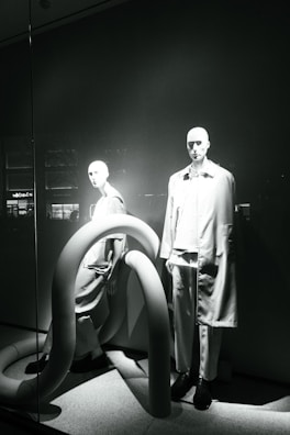 A minimalist display of lumina apparel’s signature pieces on mannequins.