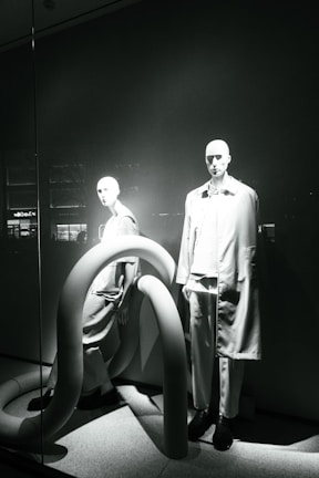 Minimalist store window featuring a single Evolution Premium mannequin dressed in contemporary attire.