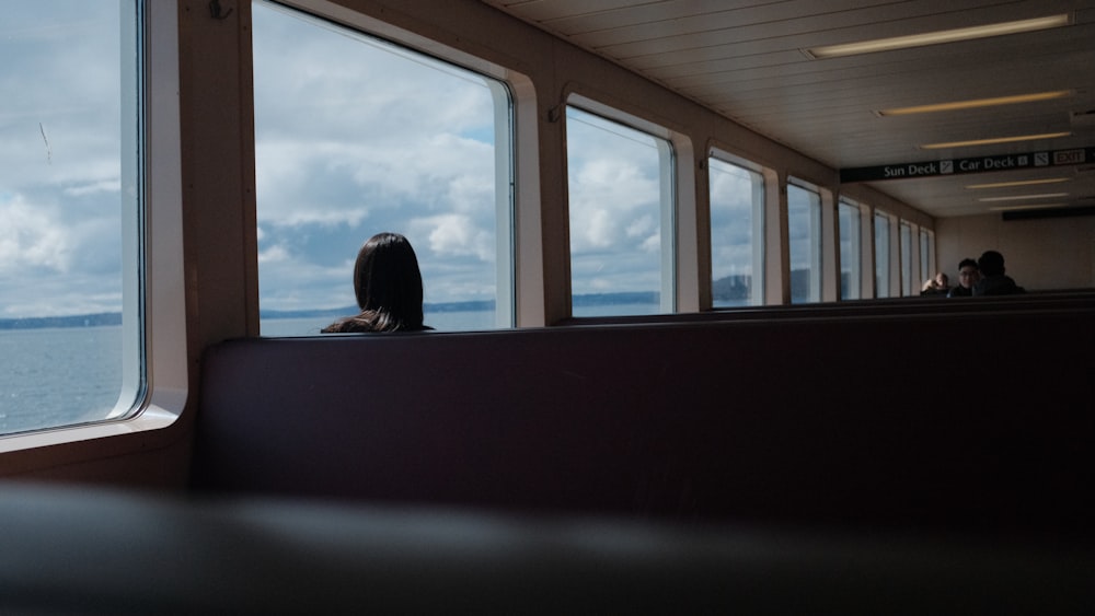 a bird is sitting on the edge of a window