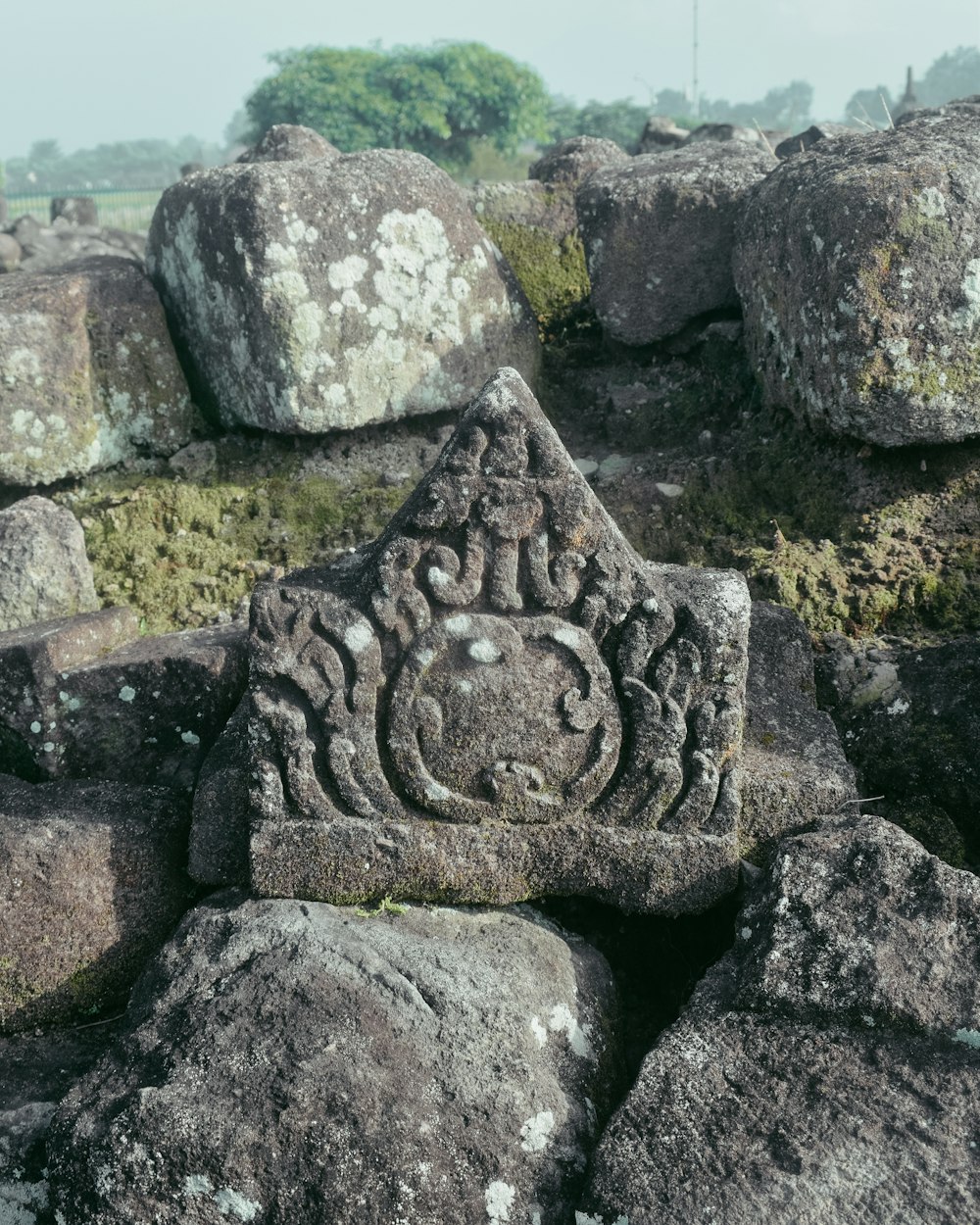 a close up of a stone block with a carving on it