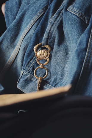 Close-up of a finely crafted metal keychain with a polished logo.