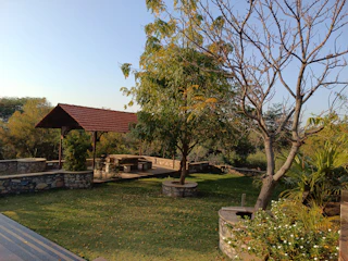 A serene outdoor garden venue surrounded by lush trees and natural greenery in Guatemala.