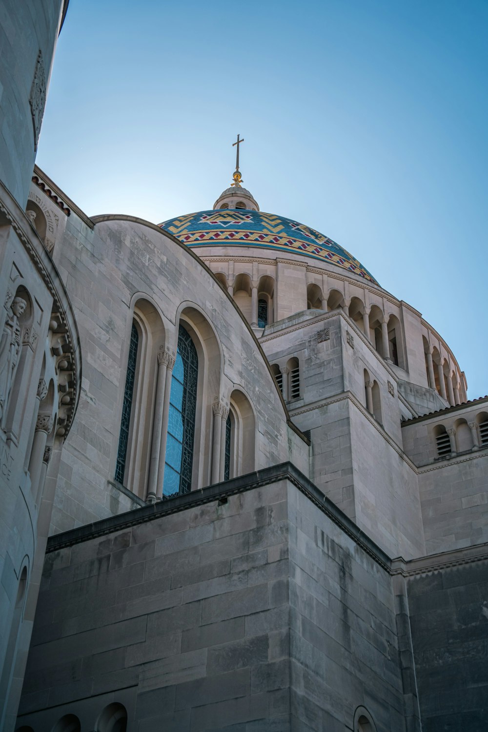 a large building with a cross on top of it