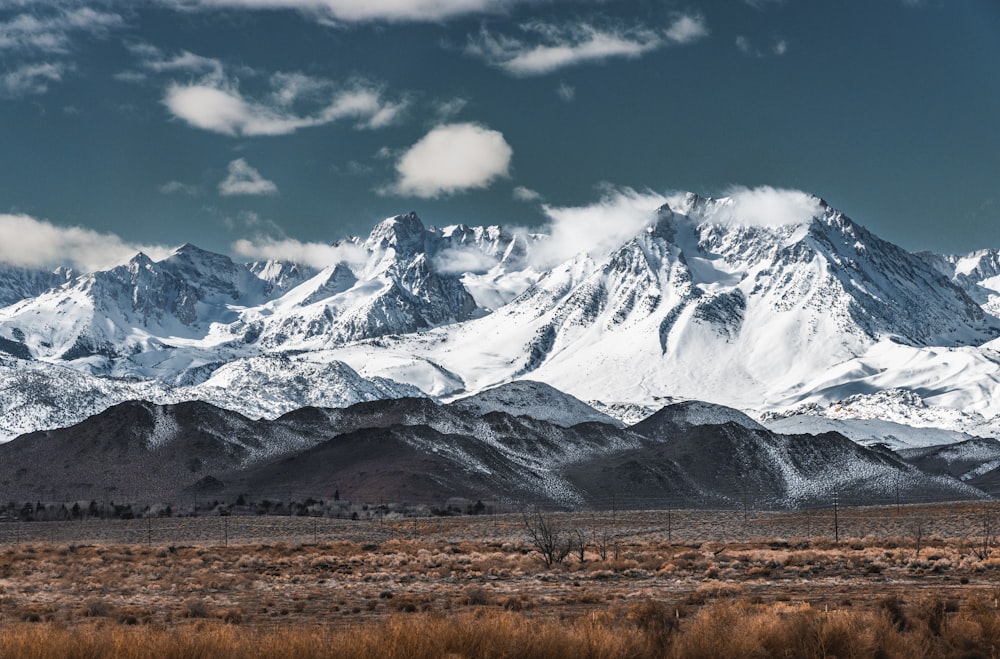 a snow covered mountain range in the desert