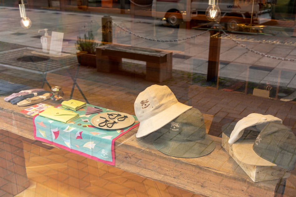 a window display with hats and other items