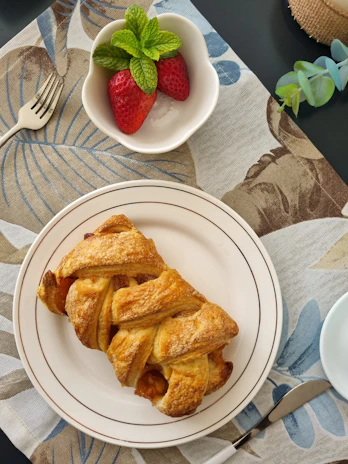 Freshly made pain doré served with a side of fruit compote and a pat of melting butter.