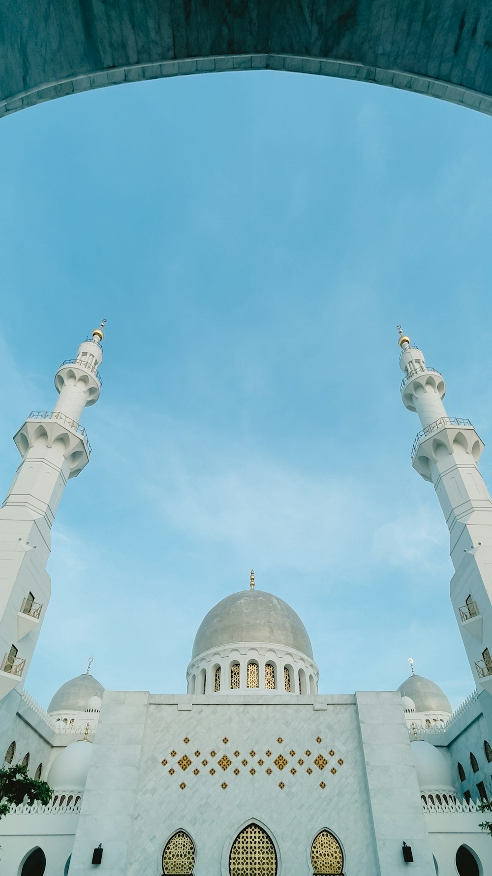 a large white building with two tall white towers