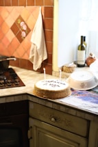 A warm, inviting kitchen scene with a beautifully decorated birthday cake on the counter.