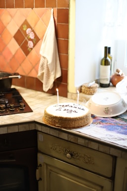 A warm, inviting kitchen scene with a beautifully decorated birthday cake on the counter.