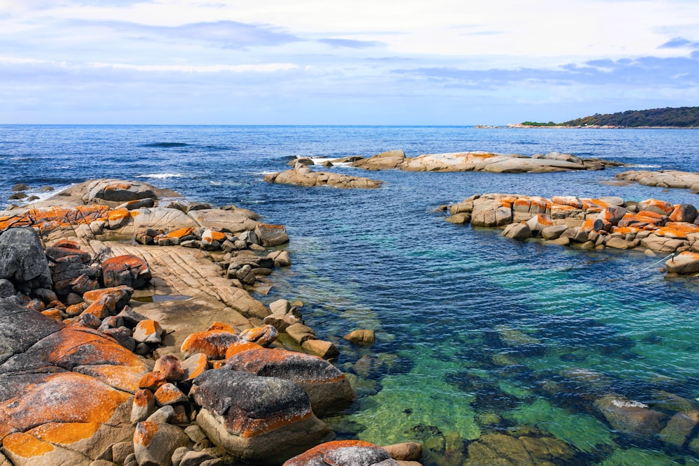 a body of water surrounded by rocks and water