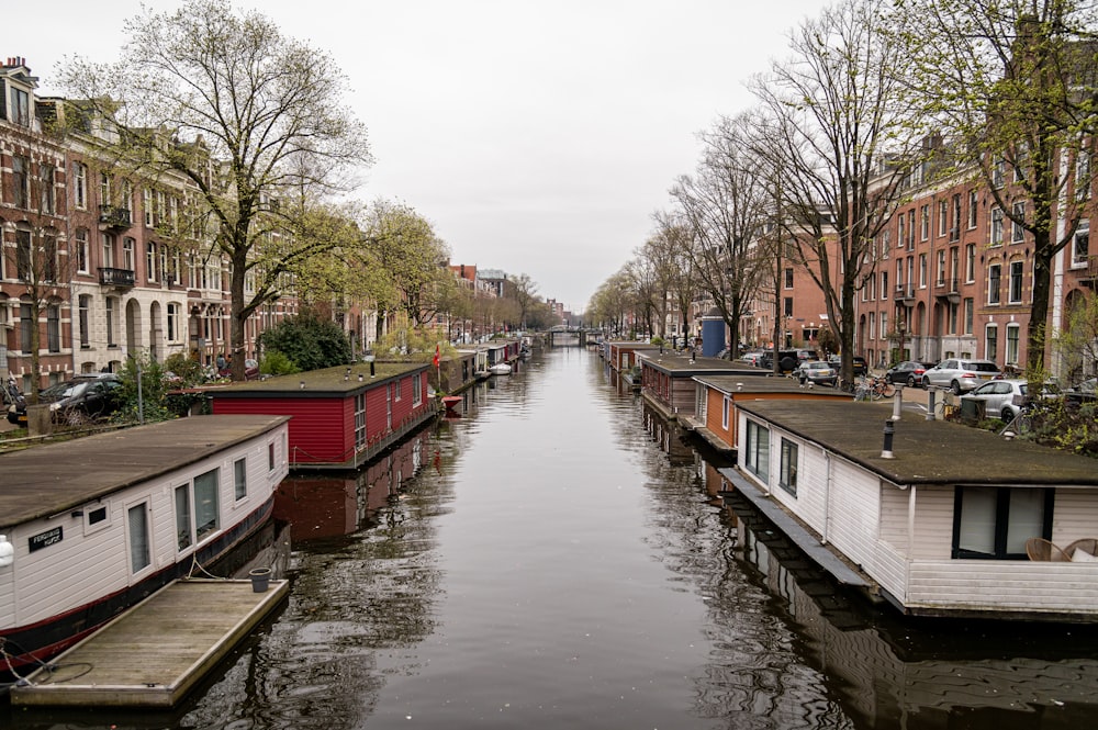 a narrow canal with houses on both sides